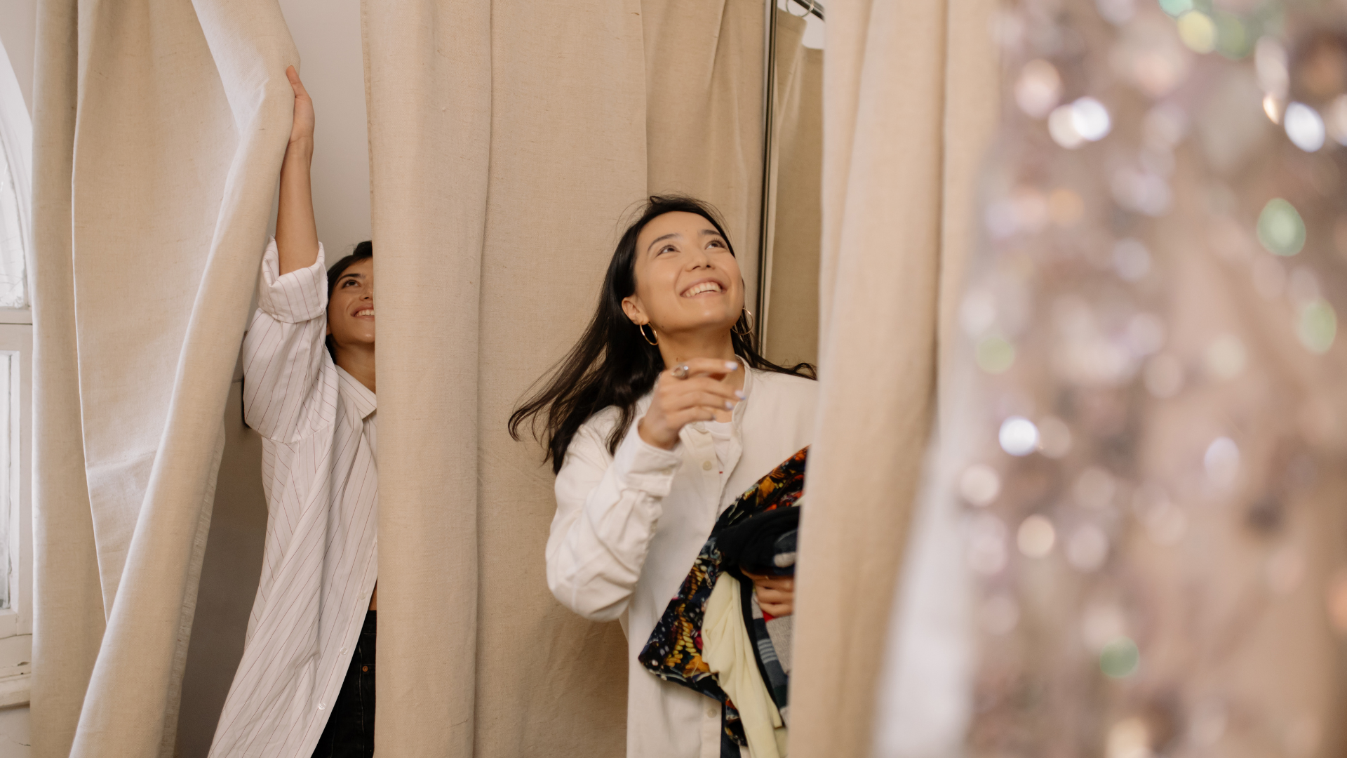 people trying on clothes at a retail store