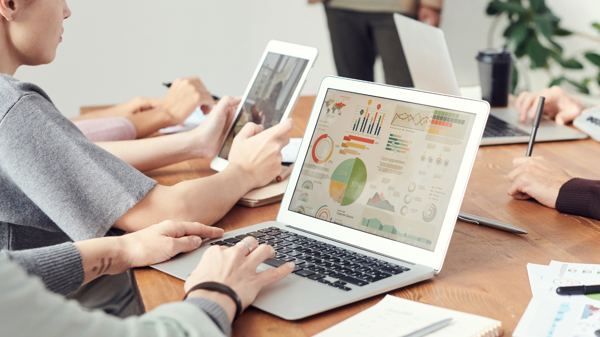 laptop with graphs and reports on the screen