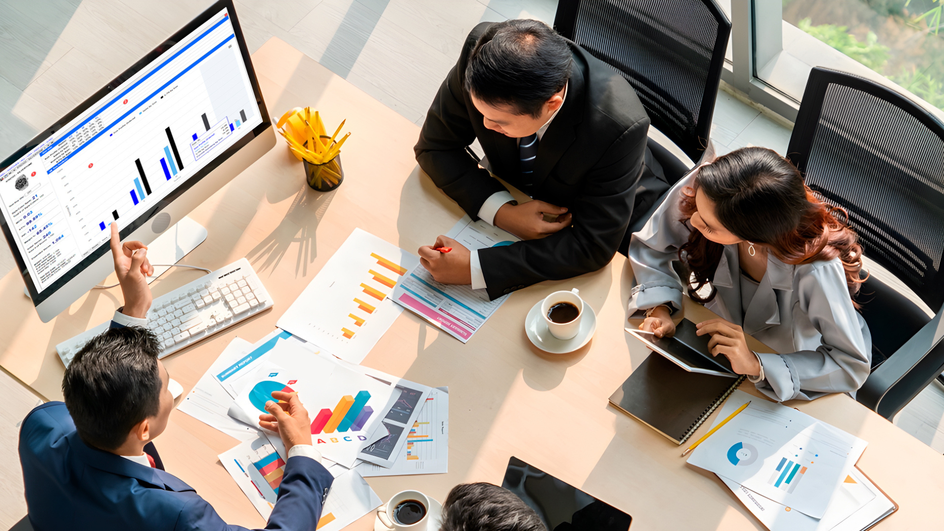 business meeting analyzing forecasts